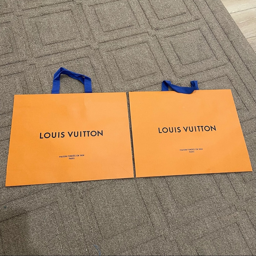 Two Louis Vuitton shoppers paper shopping bag